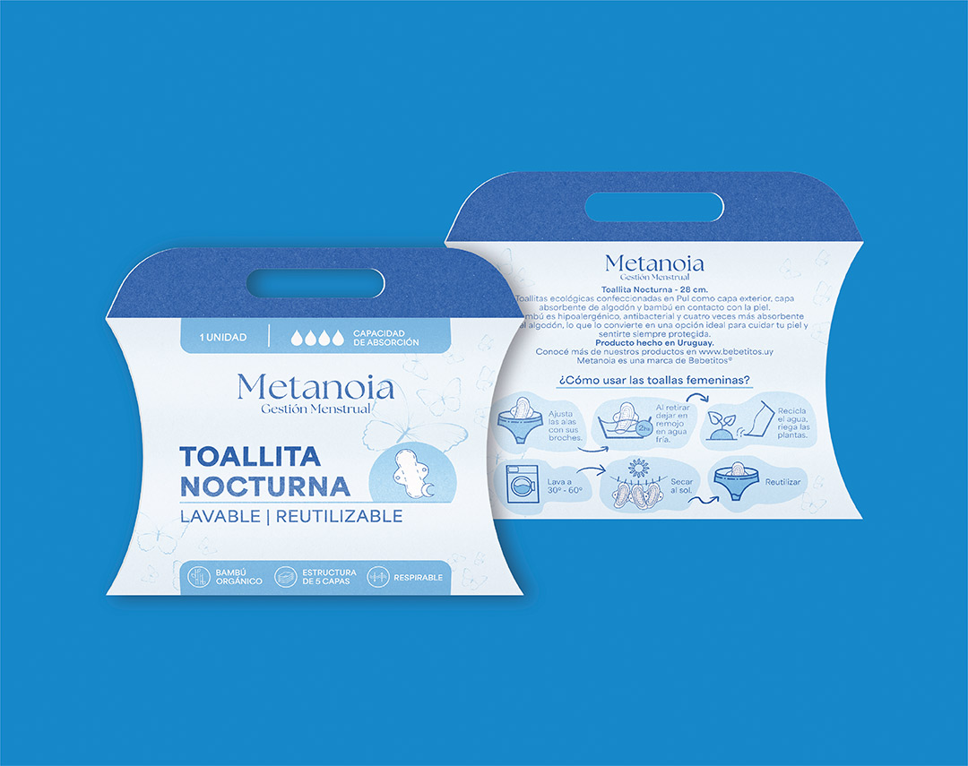 Packaging de toallita nocturna reutilizable Bebetitos, cajas tipo almohada sobre fondo azul
